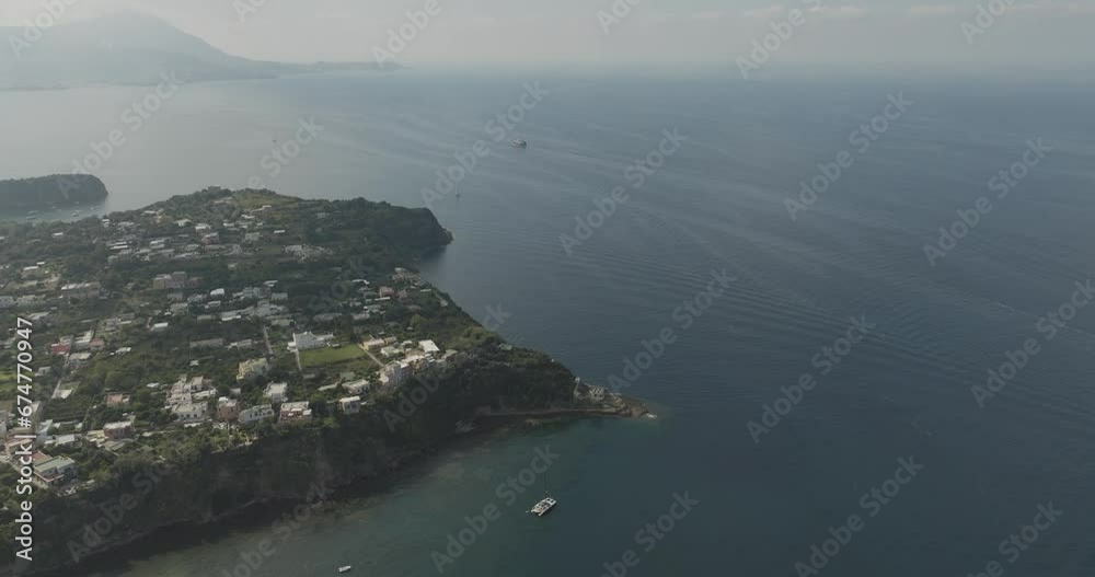Aerial view of an abandoned lighthouse on Procida Island along the Tyrrhenian Sea coastline, Flegree Islands archipelagos, Naples, Campania, Italy. Aerial view of an abandoned lighthouse on Procida Island along the Tyrrhenian Sea coastline, Flegree Islands archipelagos, Naples, Campania, Italy.