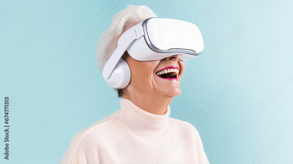 Portrait of a happy smiling enthusiastic Caucasian elderly old, senior woman grey-haired in a virtual reality headset on a blue background. Portrait of a happy smiling enthusiastic Caucasian elderly old, senior woman grey-haired in a virtual reality headset on a blue background.
