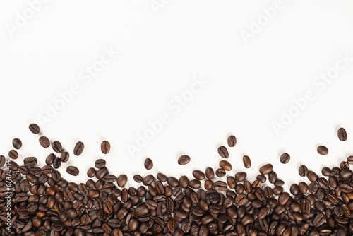 Top view of coffee beans isolated on white background, use for text or advertisement.