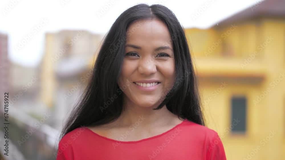 youth, confidence - indian girl staring serious at camera changes expression 