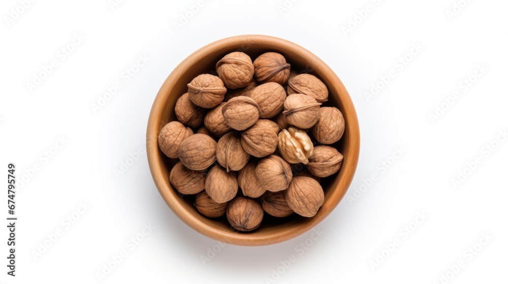 A wooden bowl filled with nuts on top of a white surface A wooden bowl filled with nuts on top of a white surface
