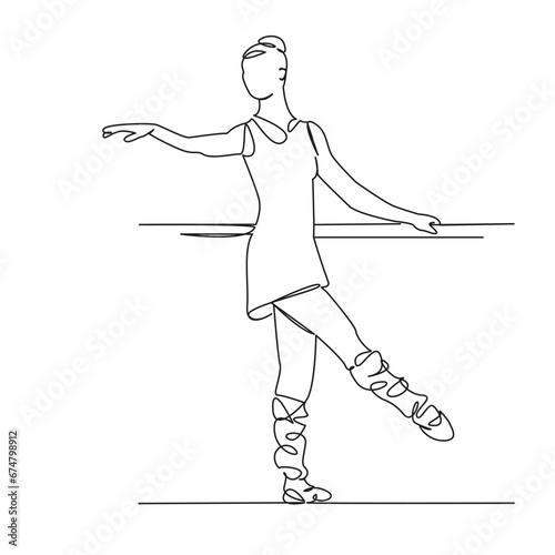 ballerina dancing at the barre rehearsing