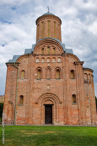 The Pyatnitskaya Church, a red brick edifice with a dome and a cross adorning its pinnacle, representing a medieval brick church in the Ukrainian city of Chernihiv. photo