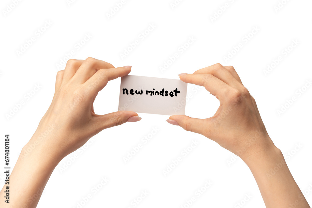 New mindset - new result text on a card in a woman hand. New mindset - new result text on a card in a woman hand.