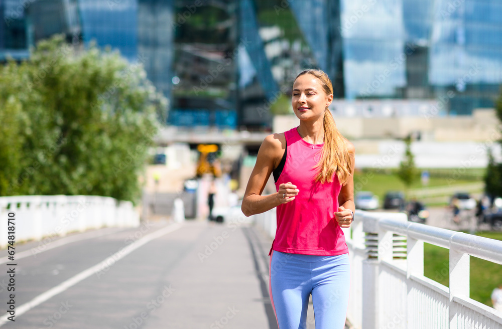 Beautiful woman running in an urban setting Beautiful woman running in an urban setting