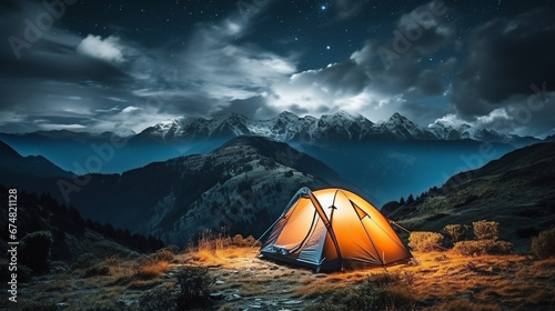 Tourist tent in the mountains at night with beautiful starry sky