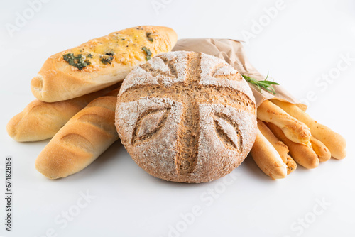 Assorted farm bread on a white background.