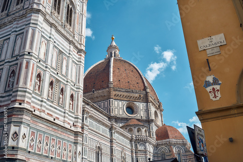 In the centre, Brunelleschi's dome of the Santa Maria del Fiore cathedral, on the left a detail of Giotto's bell tower, on the right via dei Calzaiuoli in Florence