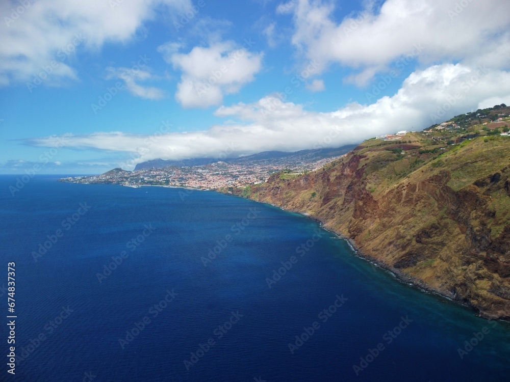 Portugal, Madeira Island, aerial view on cliffs and Funchal town from drone