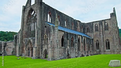 Ruins of the National Icon Monastery of Tintern Abbey in Wales. Ruins of a Cistercian abbey with Gothic West Front and a gift shop  in the village of Tintern in Monmouthshire, Wales
 photo
