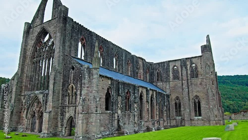 Ruins of the National Icon Monastery of Tintern Abbey in Wales. Ruins of a Cistercian abbey with Gothic West Front and a gift shop  in the village of Tintern in Monmouthshire, Wales
 photo