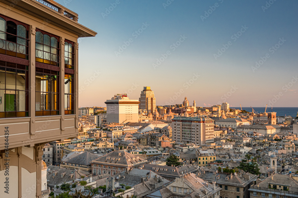 Aerial view of the downtown of Genoa at the sunset seen from Castelletto with famous public elevator