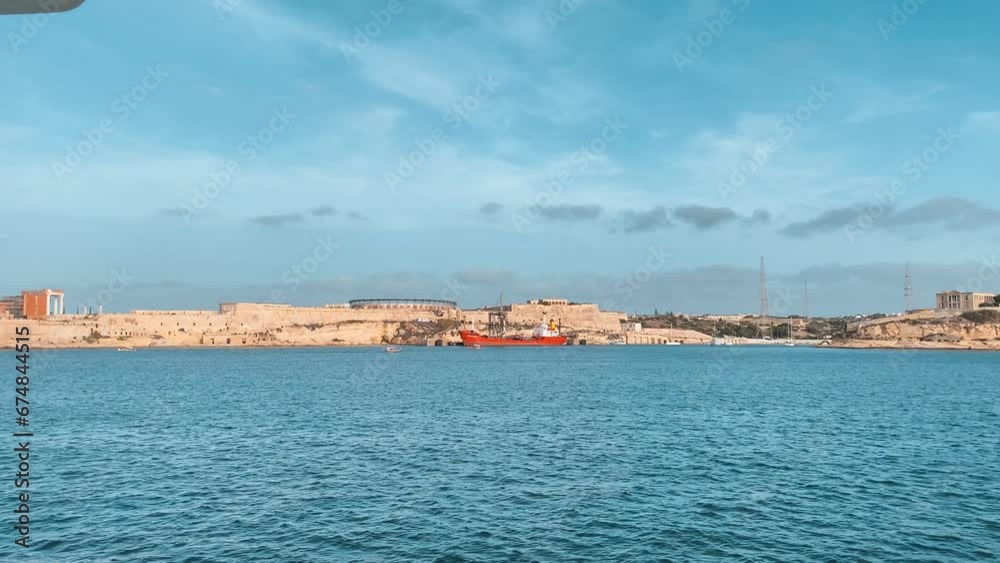 Fort Rikazli or Fort Ricasoli, Kalkara view from the sea. Gladiator arena in the middle of the fortress. Slow motion . High quality 4k footage Fort Rikazli or Fort Ricasoli, Kalkara view from the sea. Gladiator arena in the middle of the fortress. Slow motion . High quality 4k footage
