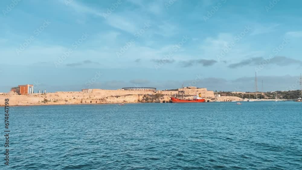 Fort Rikazli or Fort Ricasoli, Kalkara view from the sea. Gladiator arena in the middle of the fortress. Slow motion . High quality 4k footage Fort Rikazli or Fort Ricasoli, Kalkara view from the sea. Gladiator arena in the middle of the fortress. Slow motion . High quality 4k footage