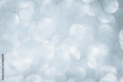 neutral shaped structured silver background with bokeh effect photo