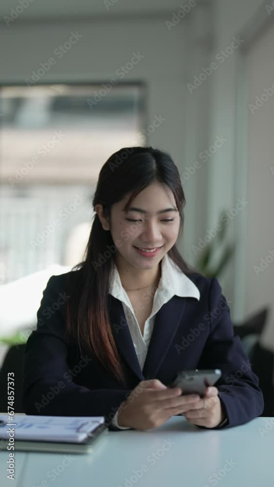 Happy Asian woman using smartphone and Excited.. Happy Asian woman using smartphone and Excited..