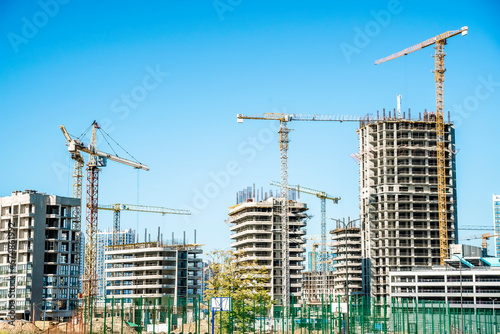 Construction of a building banner background. Construction site with crane. Business, development, industry.