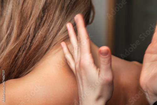 Close up of masseur hands doing back massage for lady patient in beauty SPA salon. Back massaging procedure for adult woman, medical therapy. Healthy lifestyle, well-being concept. Copy ad text space