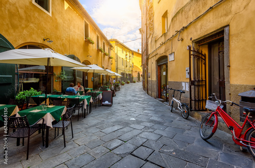 Old cozy street in Lucca, Italy. Architecture and landmark of Lucca. Cozy cityscape of Lucca.