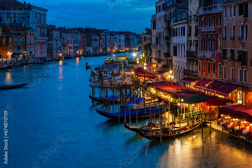 Grand Canal with gondolas in Venice, Italy. Night view of Venice Grand Canal. Architecture and landmarks of Venice. Venice postcard