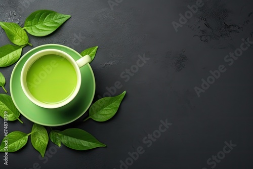 Healthy Light Green Tea Cup with Fresh Green Leaves photo
