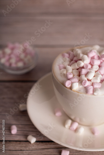 This photography sets a delightful atmosphere with marshmallows and a delicious drink. The sweet dessert backdrop.candy, mug, enjoyment, mood, vertical, minimalism