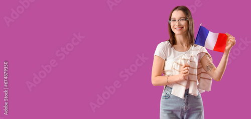 Young woman holding flag of...