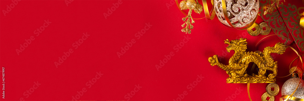 Chinese New Year 2024 greeting card. Bright red asian year of the dragon background with golden dragon figurine, Chinese lanterns, traditional jewelry, gifts, coins, cookies with wishes, copy space Chinese New Year 2024 greeting card. Bright red asian year of the dragon background with golden dragon figurine, Chinese lanterns, traditional jewelry, gifts, coins, cookies with wishes, copy space
