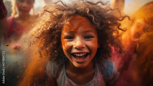 A young girl is covered in colored powder