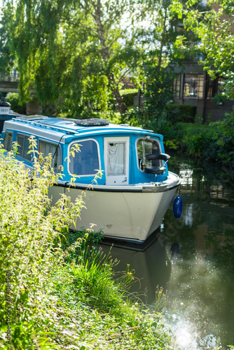 A house boat docked on Stort River in Bishop's Stortford in England