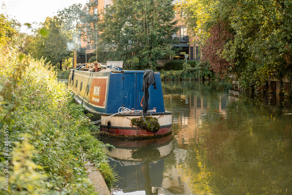 A house boat docked on Stort River in Bishop's Stortford in England A house boat docked on Stort River in Bishop's Stortford in England