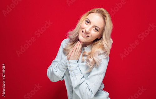 Happy young woman while keeps palms closed. Happy woman with smile face expression, isolated on white background