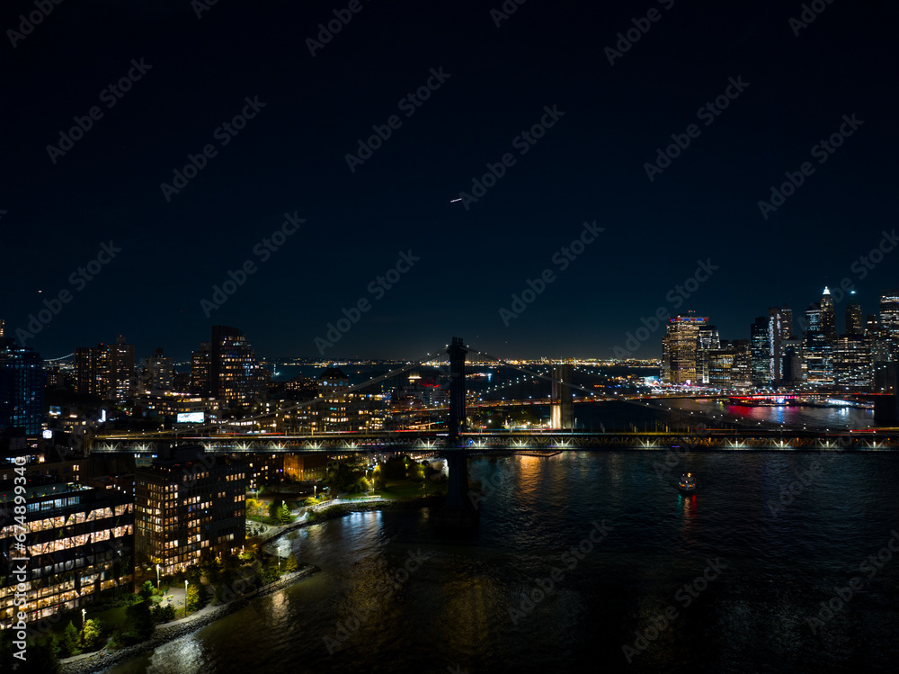 Night aerial photo Dumbo New York. View of river and bridges