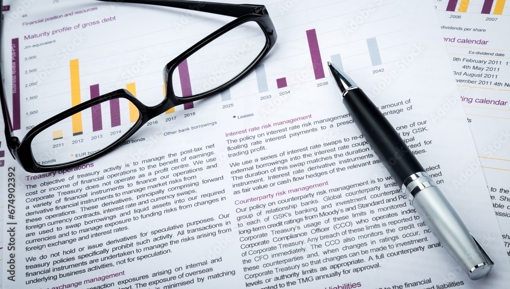 Glasses And Pen On Business Sheets Close-up Glasses And Pen On Business Sheets Close-up