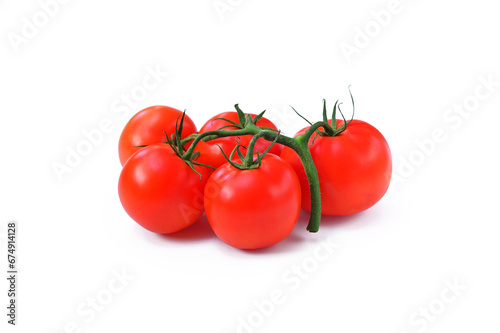 fresh tomatoes on a branch isolated on white background close up