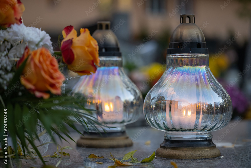 Lanterns and flowers on the grave on All Saints' Day