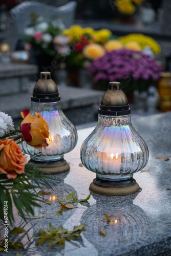 Lanterns and flowers on the grave on All Saints' Day