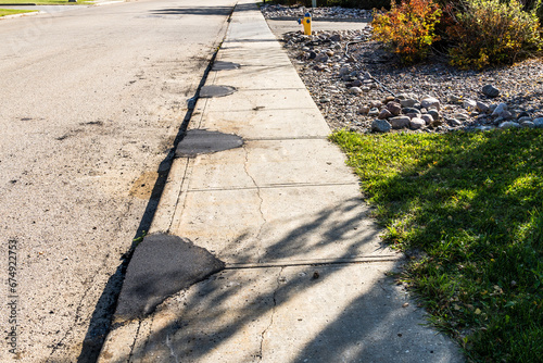Obraz na plátne Concrete sidewalk repair with asphalt patching