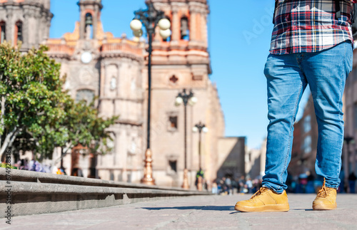 Young tourist view from chest to feet in San Luis Potosi downtown in Mexico  low angle shot  copy space