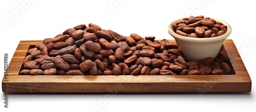 Beautiful fresh cocoa beans and cocoa seeds on the wooden tray