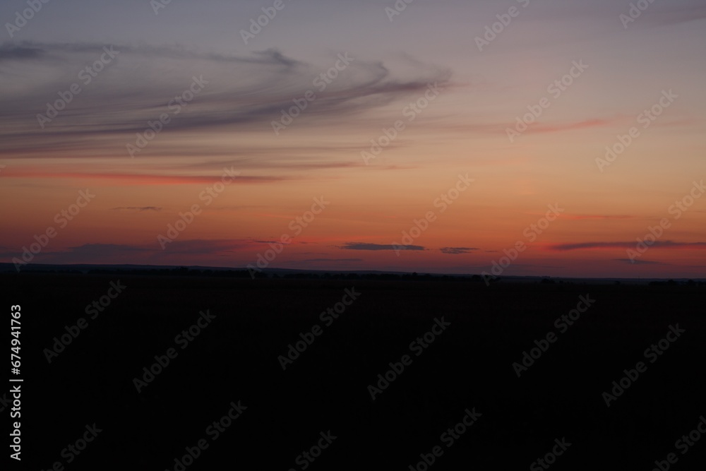 Dark blue Sky Horizon with Sunset Clouds