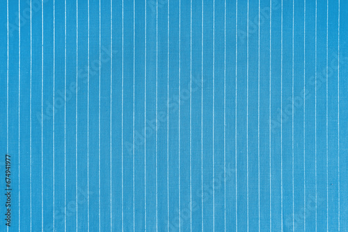 Striped blue white fabric texture background wtih copy space. Shirt fabric, tablecloth textile, garment cloth, upholstery with classic pattern with lines. Backdrop, wallpaper, background.