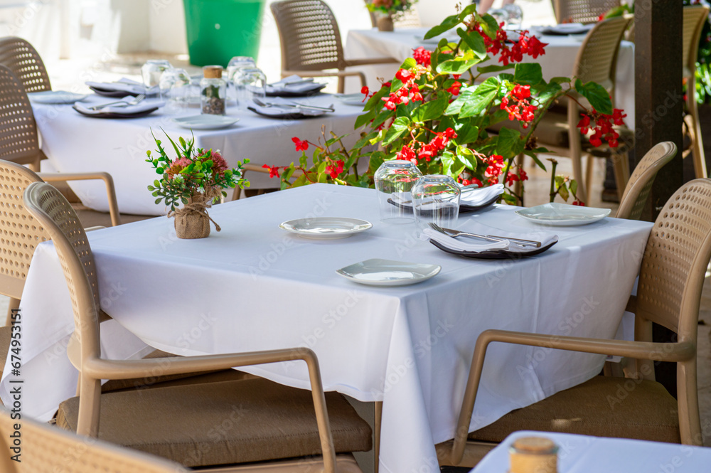 Served restaurants tables are waiting for clients Served restaurants tables are waiting for clients