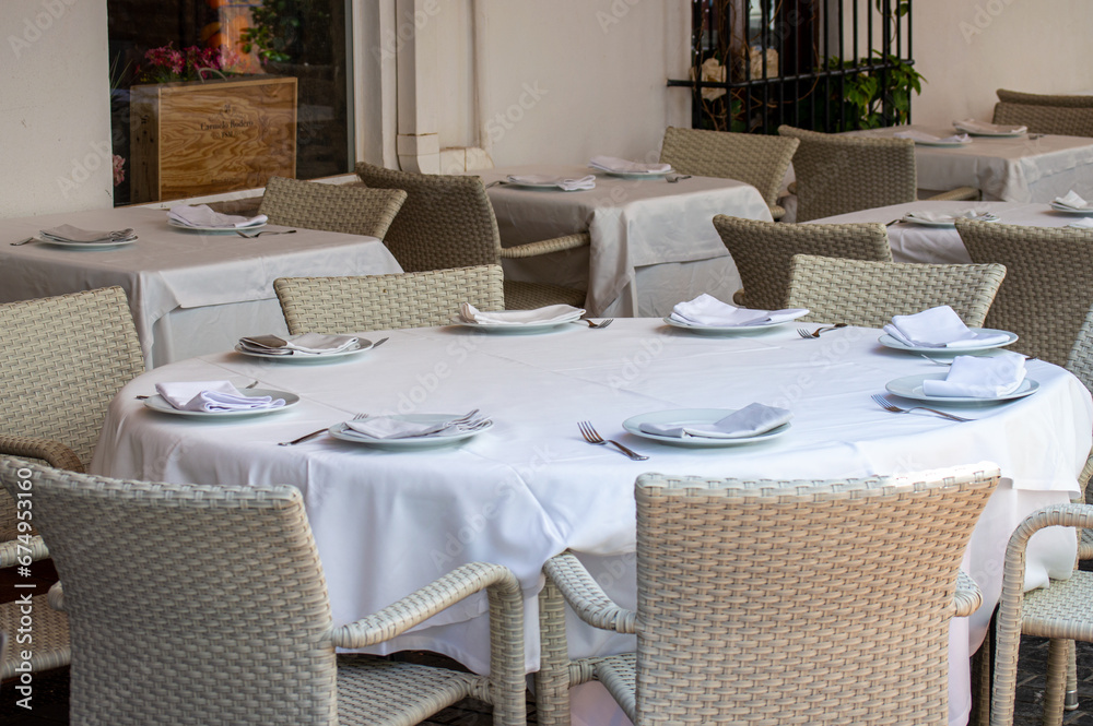 Served restaurants tables are waiting for clients Served restaurants tables are waiting for clients