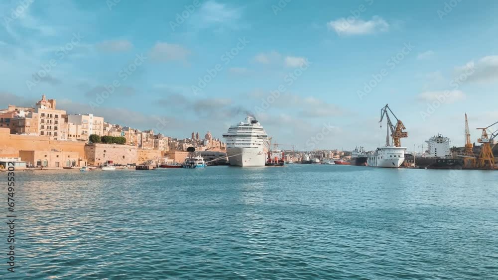 Valletta, Malta. 23rd October 2023 - Parlatorio Wharf Malta Dry dock , Kordin Grain Terminal and Valleta Gateway terminals, timelapse from the sea. High quality 4k footage Valletta, Malta. 23rd October 2023 - Parlatorio Wharf Malta Dry dock , Kordin Grain Terminal and Valleta Gateway terminals, timelapse from the sea. High quality 4k footage
