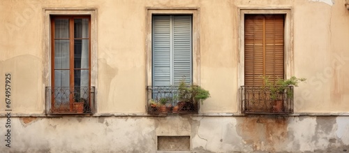 In the heart of Italy an old vintage house stands proudly its retro architecture and charming metal window frames capturing the essence of European urban living