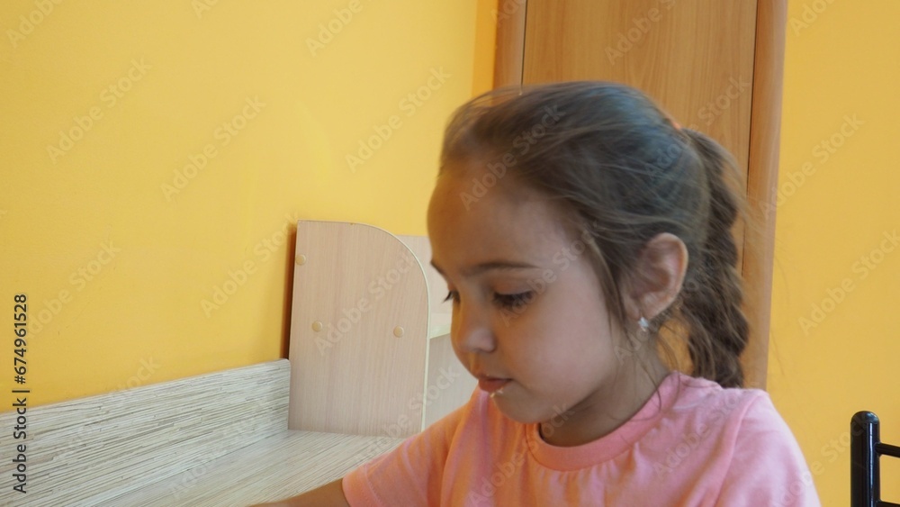 little happy girl eating carrot cake in a cafe. Happy child enjoying dessert and coffee with closed eyes, sitting in cafe. girl eating cake, spending time in cafeteria.