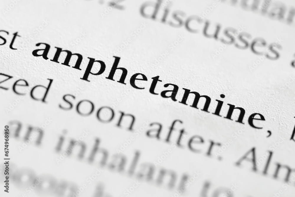 Amphetamine, addictive substance used in medical field and as an illegal substance or drug printed in black on white page of book close-up Amphetamine, addictive substance used in medical field and as an illegal substance or drug printed in black on white page of book close-up