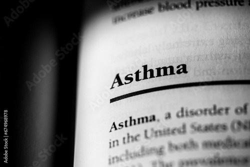 Asthma, respiratory disorder causing breathing issues, printed in black on white page close-up    photo