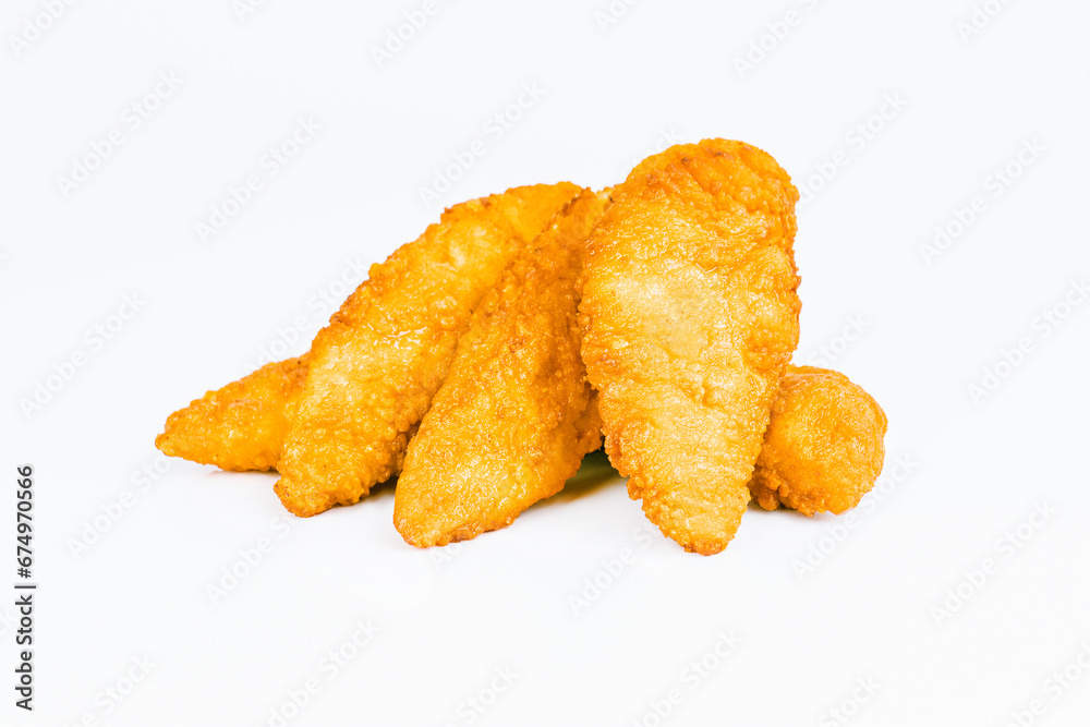 Breaded Chicken Inner Fillet on a White Background,Chicken Breaded Raw Meat.Chicken Breaded Fillet.Fast food. Fast cooking. Breaded chicken nuggets. Homemade food at home.